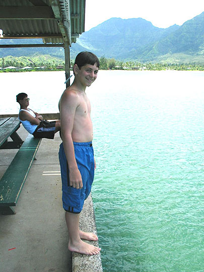 Adam about to jump from the Hanalei Pier